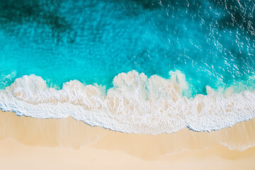 Obraz premium Pristine beach with crystal-clear turquoise waters lapping gently against the shore