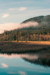 Torsæterkampen Hill seen from the Skjeppsjøen Lake, part of the Totenåsen Hills, Norway, in fall.