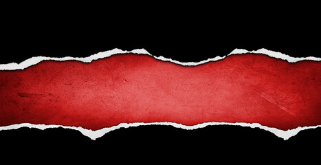 Ripped black paper on red background