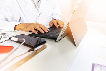 Doctors work on computers. collect patient records and medical information.