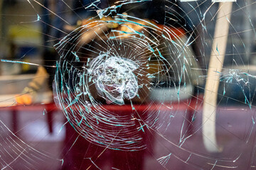 Traces of Vandalism: Shattered Shop Window in a Remote Street, Attempted Robbery