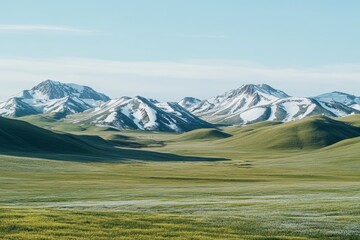 Morning light illuminates the vibrant green valleys and snow-capped peaks, showcasing a serene mountainous landscape