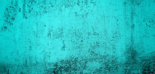 The background of the long wall is green with a combination of blue, Close-up of the facade of a building. Sunlight. Natural colors.