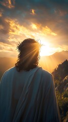 Jesus Christ with a crown of thorns on his head, seen from behind, looking at the sun in a mountainous landscape