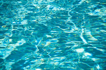 Water in swimming pool, background with high resolution. Wave abstract or rippled water texture.