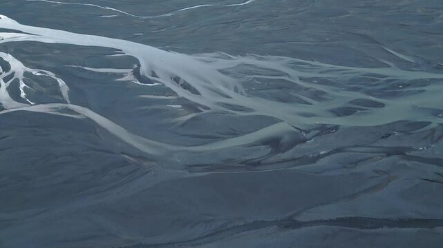 Aerial view of meandering rivers in highland terrain