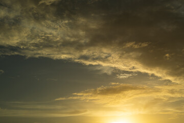 Sunset Clouds background. Dramatic Clouds Sunset Background. Sky with clouds in Sunrise. Sunrise with clouds in various shapes background. Calm Cloud.