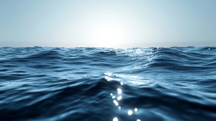 Fototapeta premium The ocean is calm and the sun is shining on the water