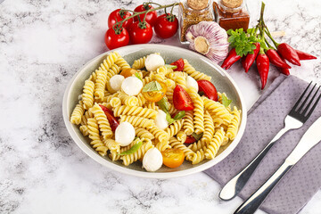Italian pasta with mozzarella and tomato