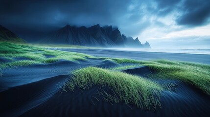Dark storm clouds gather over a tranquil black sand beach, where vibrant green grass sways gently in the breeze, contrasting beautifully with rugged mountains in the distance