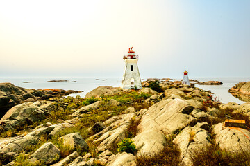 lighthouse on stark granite rocks in summer room for text shot bustard rocks remote georgian bay
