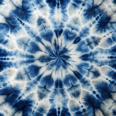 A blue and white tie dye design with a circular shape. The design is made up of blue and white stripes