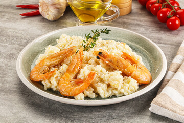 Italian risotto with prawn served thyme