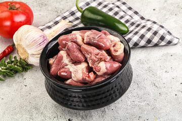 Fresh raw chicken hearts in the bowl