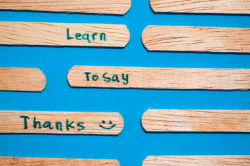 stick of ice cream with the words Learn to say Thanks. Motivational quotes, optimism, positive words. Isolated on background