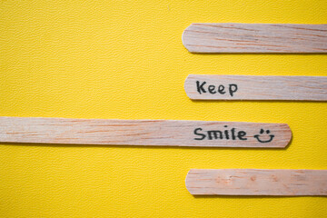 stick of ice cream with the words Keep Smile. Motivational quotes, optimism, positive words. Isolated on background