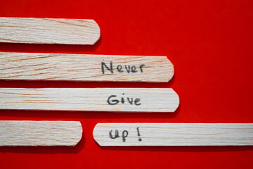 stick of ice cream with the words Never Give Up. Motivational quotes, optimism, positive words. Isolated on background