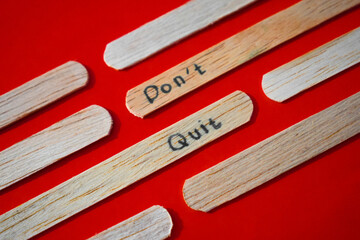 stick of ice cream with the words Don't quit. Motivational quotes, optimism, positive words. Isolated on background