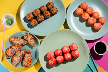 Assorted Sushi Rolls with Vibrant Presentation on Plates