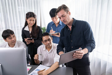 Group of diverse office worker employee working together on strategic business marketing planning in corporate office room. Positive teamwork in business workplace concept. Prudent