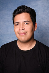 portrait of a latin man with black sweater yearbook style