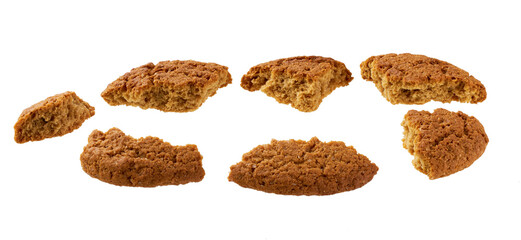 Broken round oatmeal cookies isolated on white background.