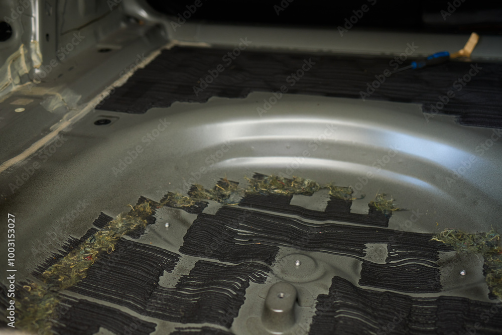 Poster using a scraper tool in a workshop is vital for craftsmanship and quality in applying material