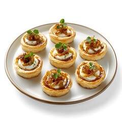 Delicious caramelized onion and goat cheese tarts on elegant plate