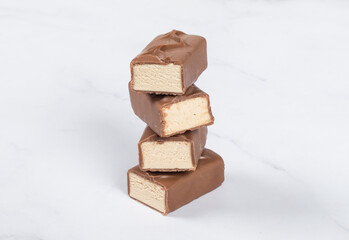 Milk souffle. In chocolate. Light gray background