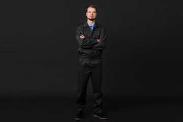 Security guard in uniform on black background