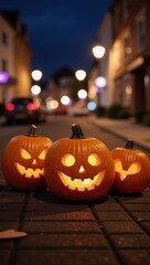 Fototapeta premium Three humorously-carved pumpkins illuminate a spooky night scene with a blurry city backdrop - perfect for a festive Halloween party setting