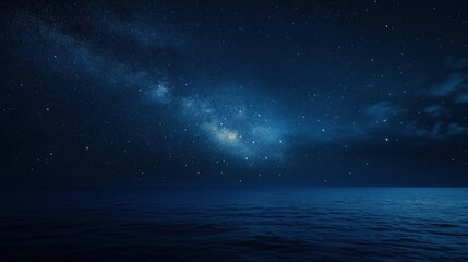 Starry night sky over calm ocean waters