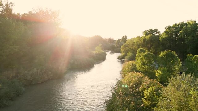 Sunset on a summer evening along the Jordan River in Murray, Utah.