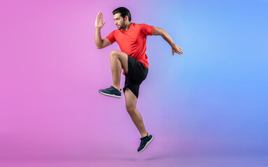 Full body length gaiety shot athletic and sporty young man fitness running cardio exercise posture on isolated background. Healthy active and body care lifestyle.