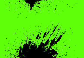 Splashes of black paint on a green background