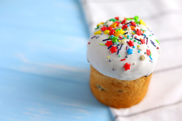 An Easter cake adorned with colorful sprinkles and candles, perfect for a festive celebration