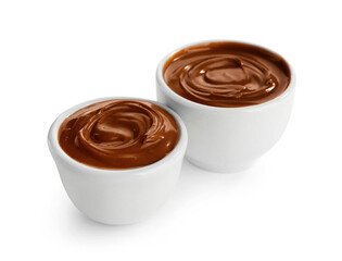 Bowls of tasty melted chocolate on white background