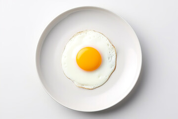 A single fried egg on a white plate, placed at the center