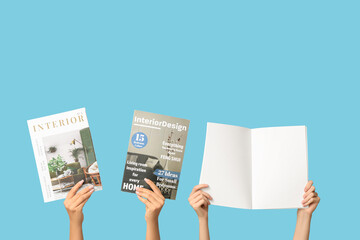 Female hands with different magazines on blue background
