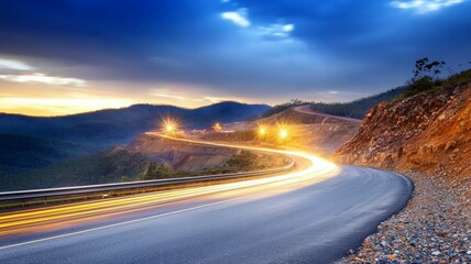 A long, curvy road with a bright light shining on it