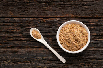 Soy fiber powdered food with psyllium fiber for colon cleansing in bowl and spoon