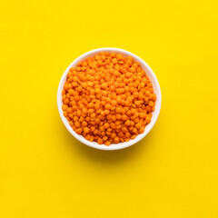 Lens culinaris - Raw red lentils in a bowl.
