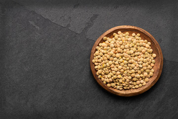 Lens culinaris - Brown lentils in a bowl.