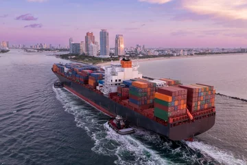 Container ship coming into the the port in Miami, via the channel in South Pointe, Miami, Florida, United States.