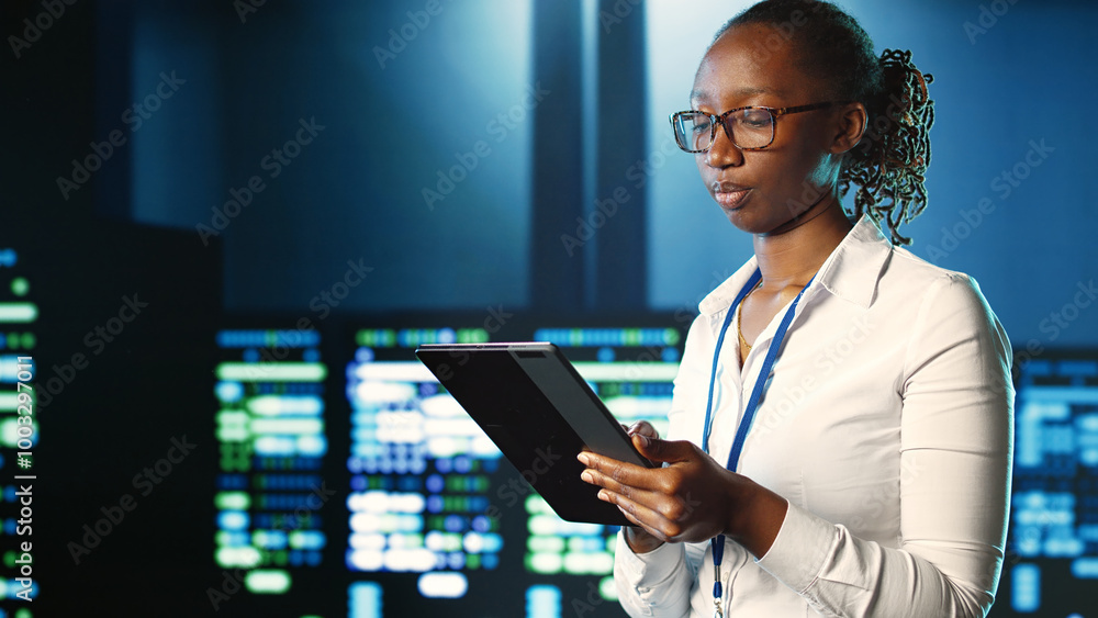 Poster adept professional strolling through server rows providing processing resources for different worklo