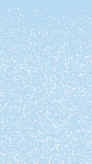 Beautiful snowfall christmas background. Subtle flying snow flakes and stars on light blue winter backdrop. Beautiful snowfall overlay template. Vertical vector illustration.