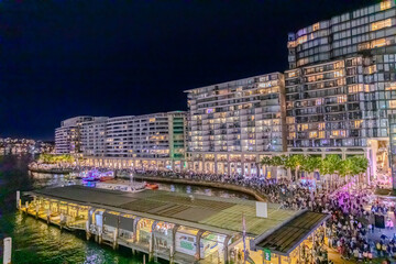 Colourful Light show at night on Sydney Harbour NSW Australia. The bridge illuminated with lasers and neon coloured lights for the Sydney Vivid light show