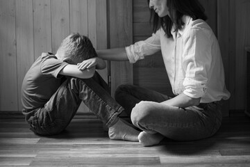 Parent comforting helping sad emotional child at home, concept of bullying, stress disappointment, sadness.