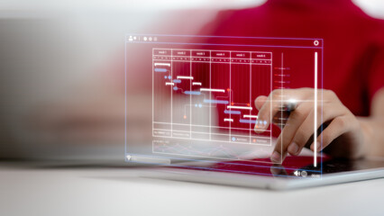 Project manager and updating tasks and milestones progress planning with Gantt chart scheduling...