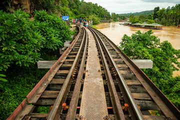 Fototapeta premium Beautiful landscape Death Railway Krasae cave, Tourist Train on The Bridge of the River Kwai at Kanchanaburi amazing Thailand.